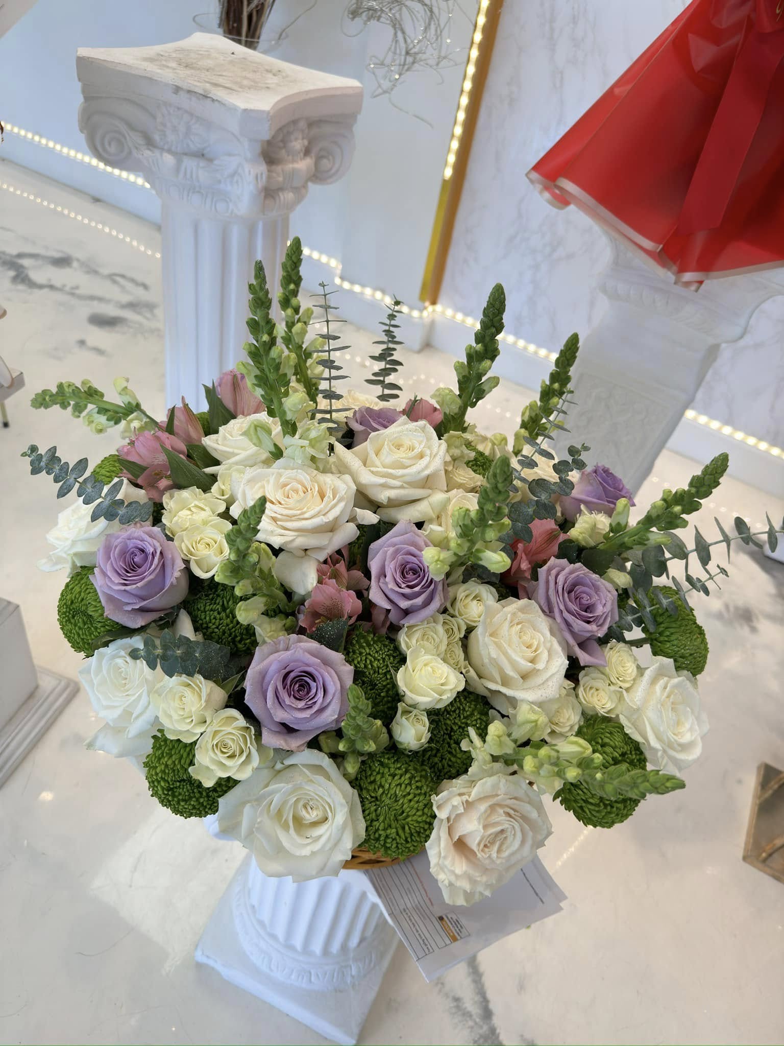 Lavender and white sympathy vase with roses, hydrangea and greenery