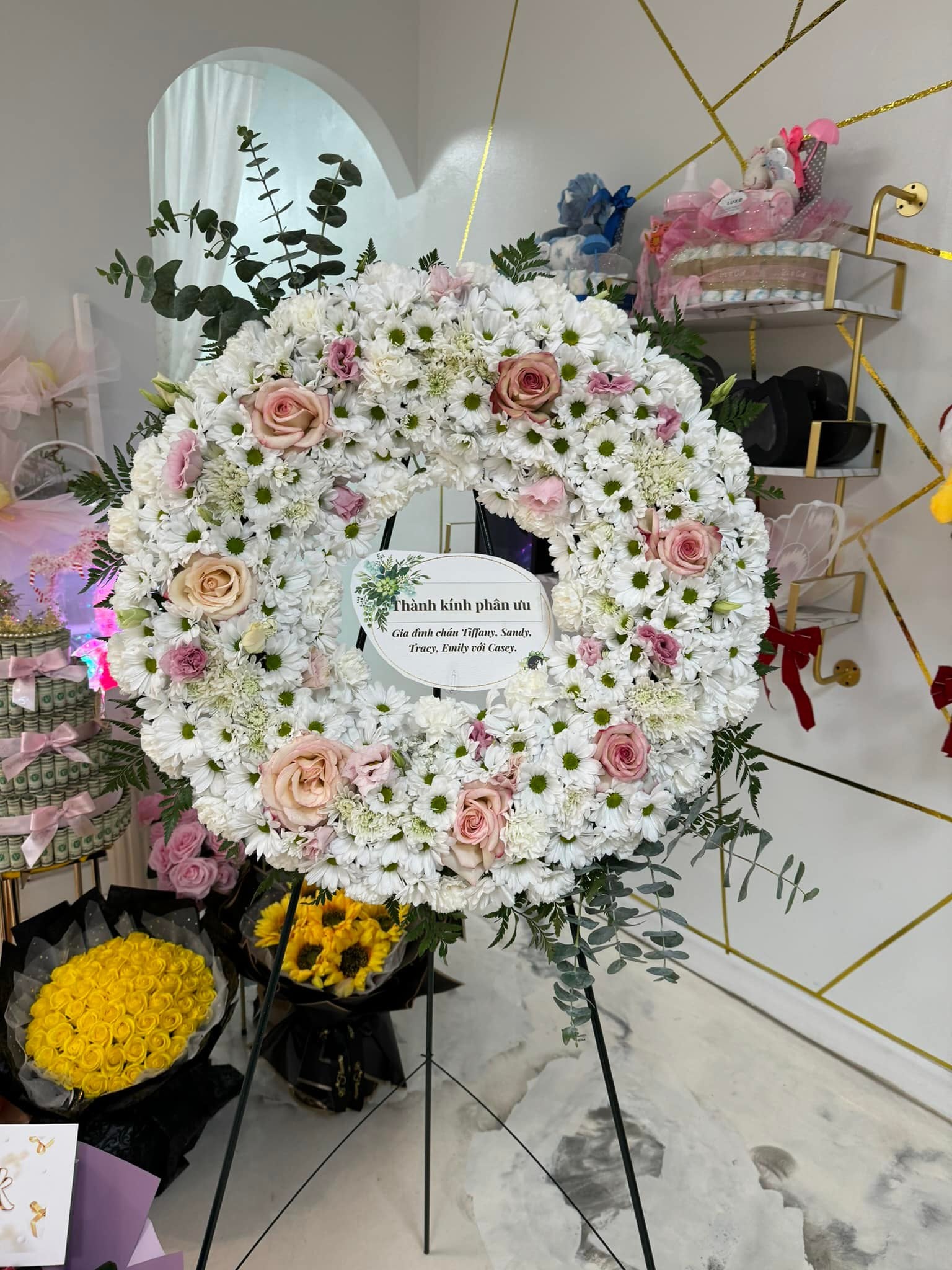 Blush and white standing sympathy wreath with chrysanthemums and pink roses by 98 Flowers Houston