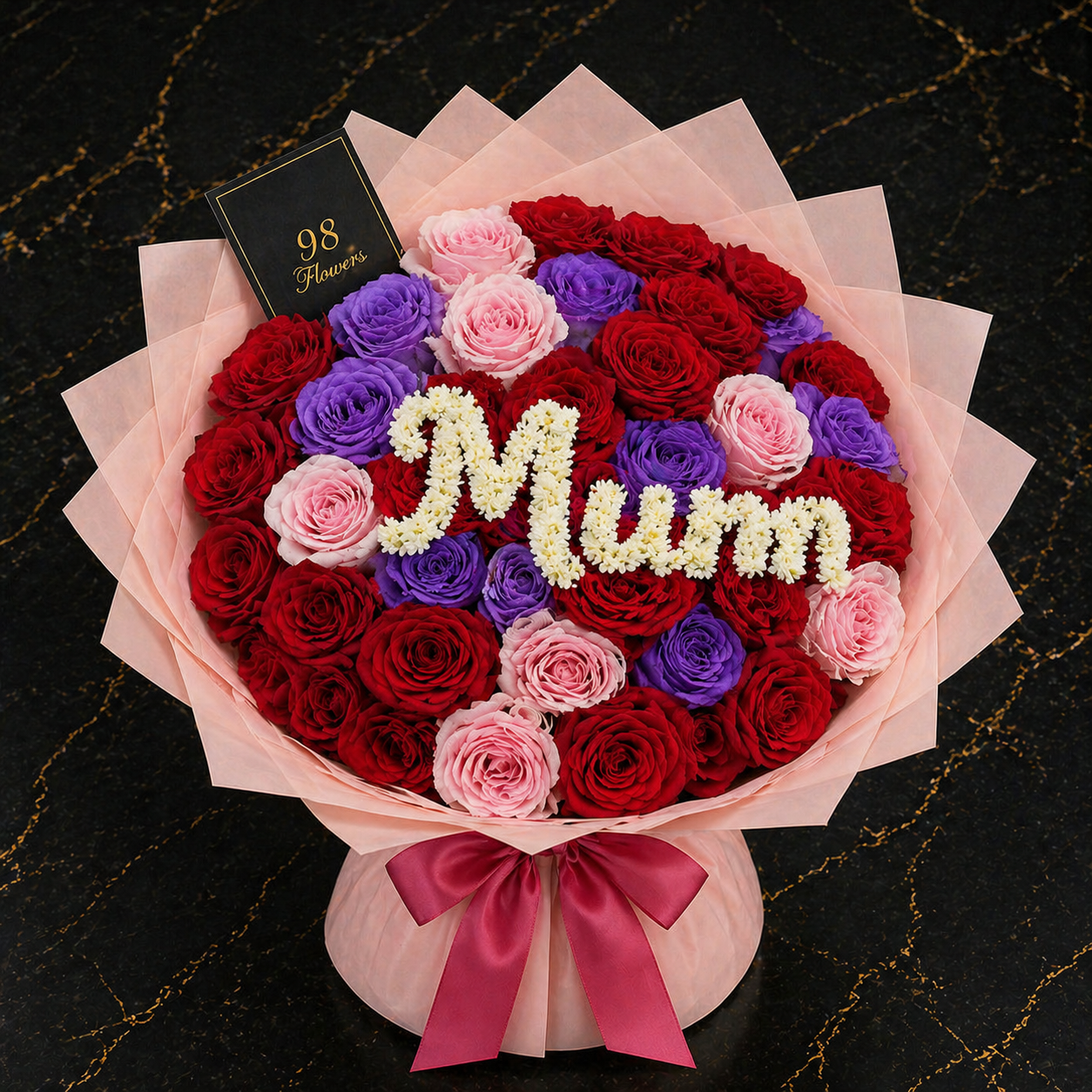 Red, pink and purple jumbo rose bouquet with white Mum floral lettering