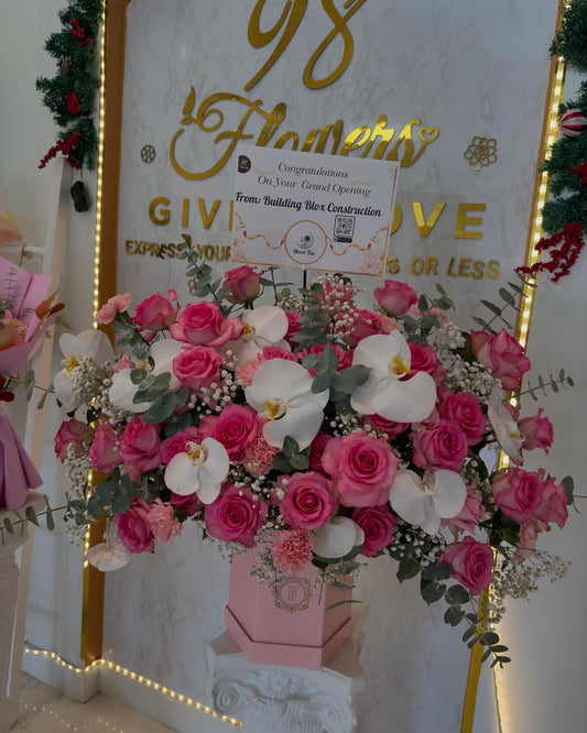Blushing Orchid Grand Opening Arrangement - 98 FLOWERS