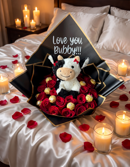 24 red roses with Ferrero Rocher and plush cow displayed by a fireplace