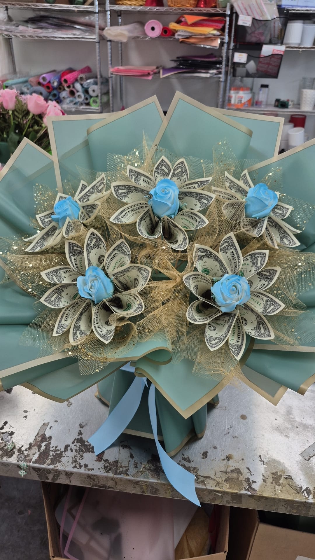 Light blue five-flower money bouquet with $30 cash included