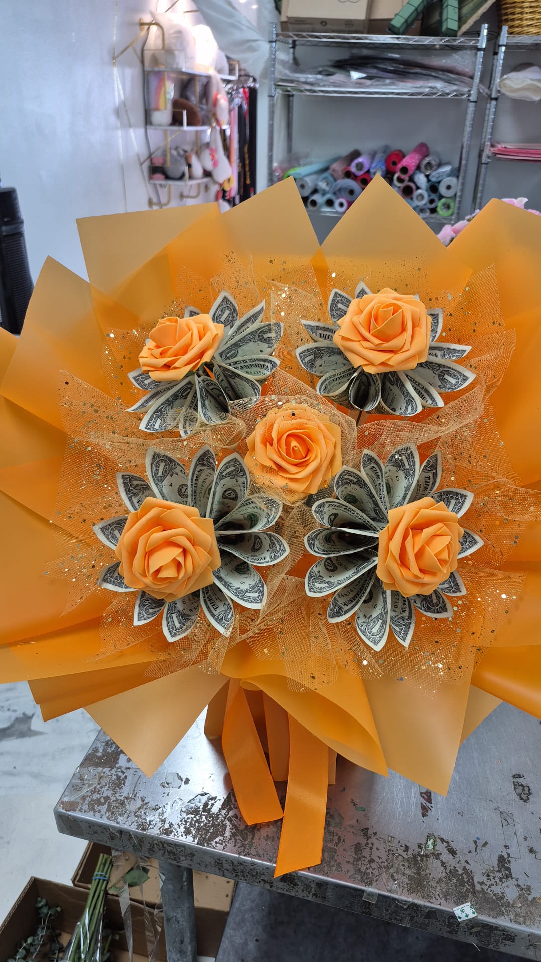 Full view of orange five-flower money bouquet