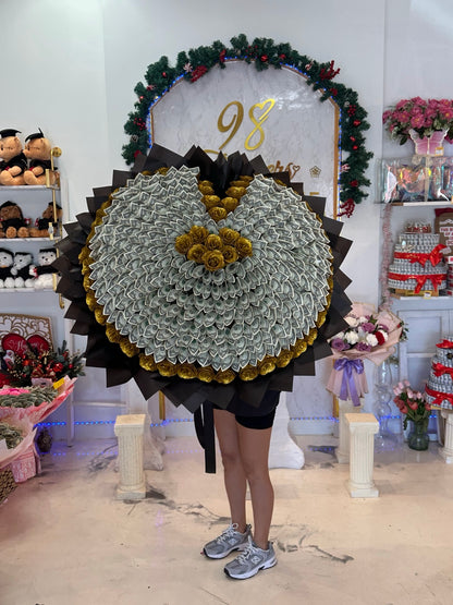 Front view of a giant heart money bouquet with gold roses, black wrapping, and 200 one-dollar bills