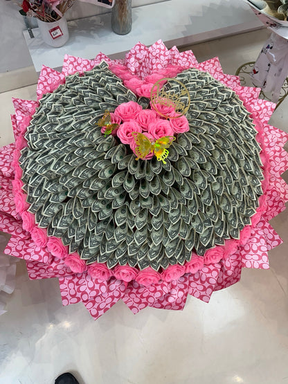 Pink giant heart money bouquet with butterfly accents, birthday topper, and 200 one-dollar bills