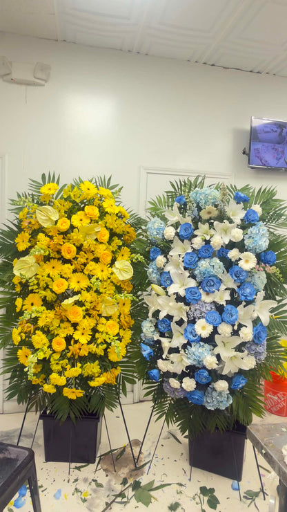 Pair of grand yellow and blue-white sympathy standing sprays
