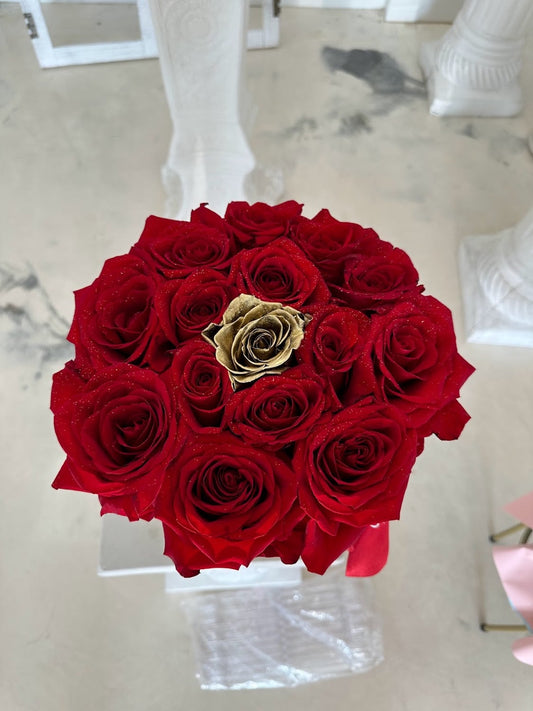 Golden Kiss round red rose box with approximately 15 roses and a gold accent rose