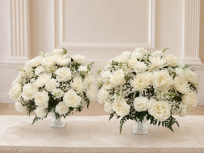 Alternate view of two white funeral flower vases on a clean ivory background
