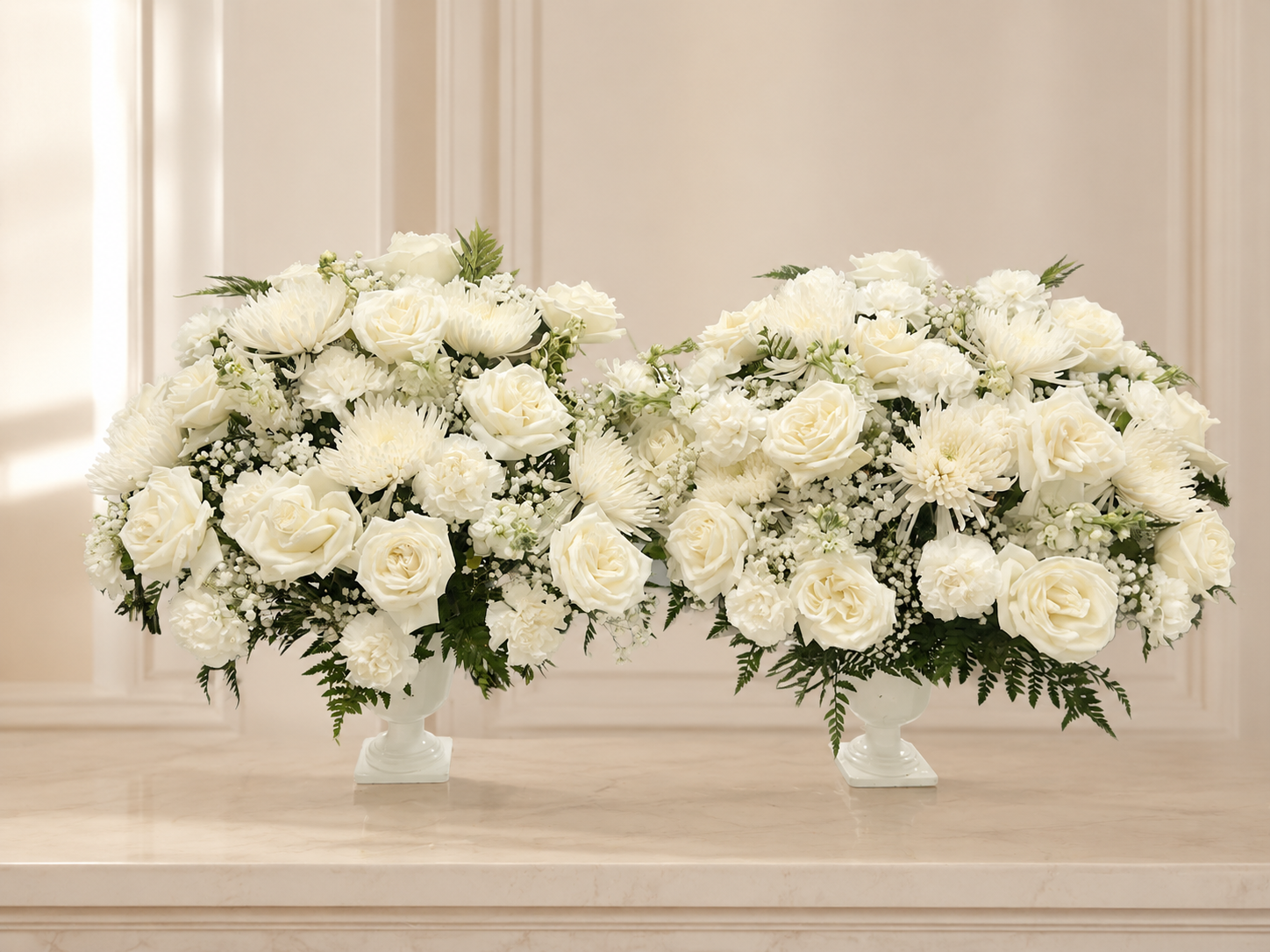Set of two white funeral flower vases on an elegant ivory memorial background