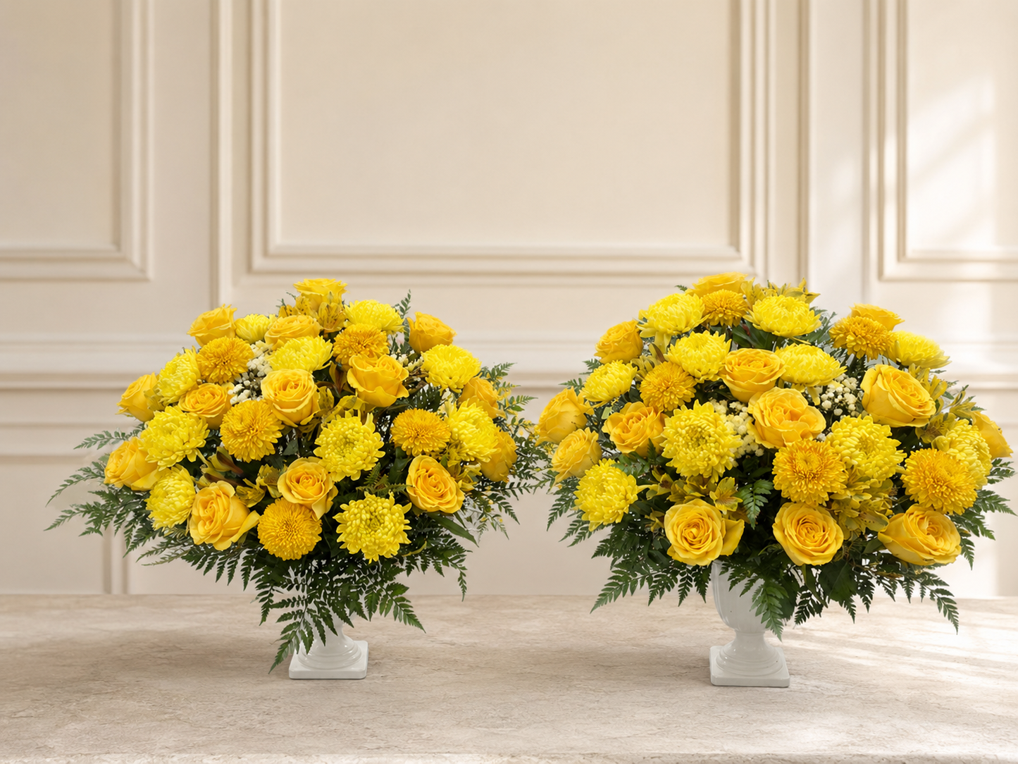Alternate view of two yellow funeral flower vases on a clean ivory background