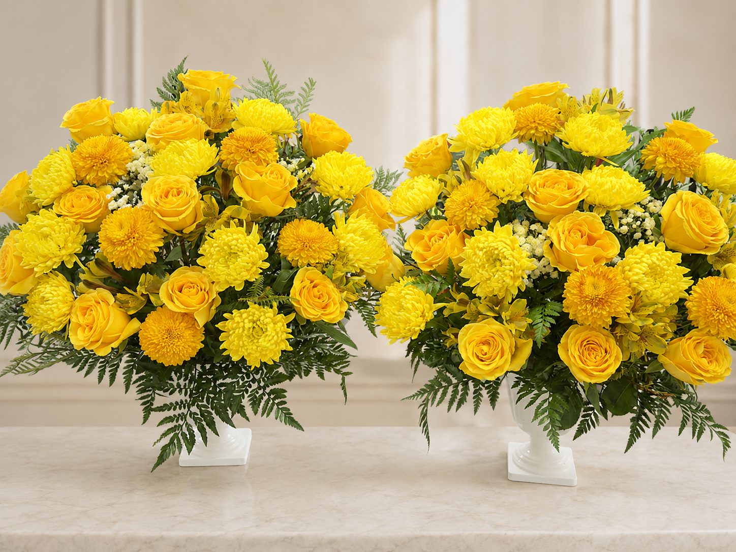 Set of two yellow funeral flower vases on an elegant ivory memorial background