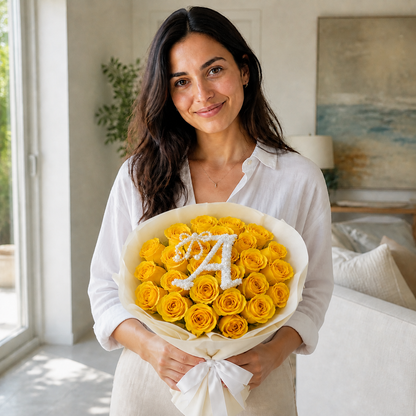 Woman holding Sunlit Charm 25 yellow roses with optional letter A