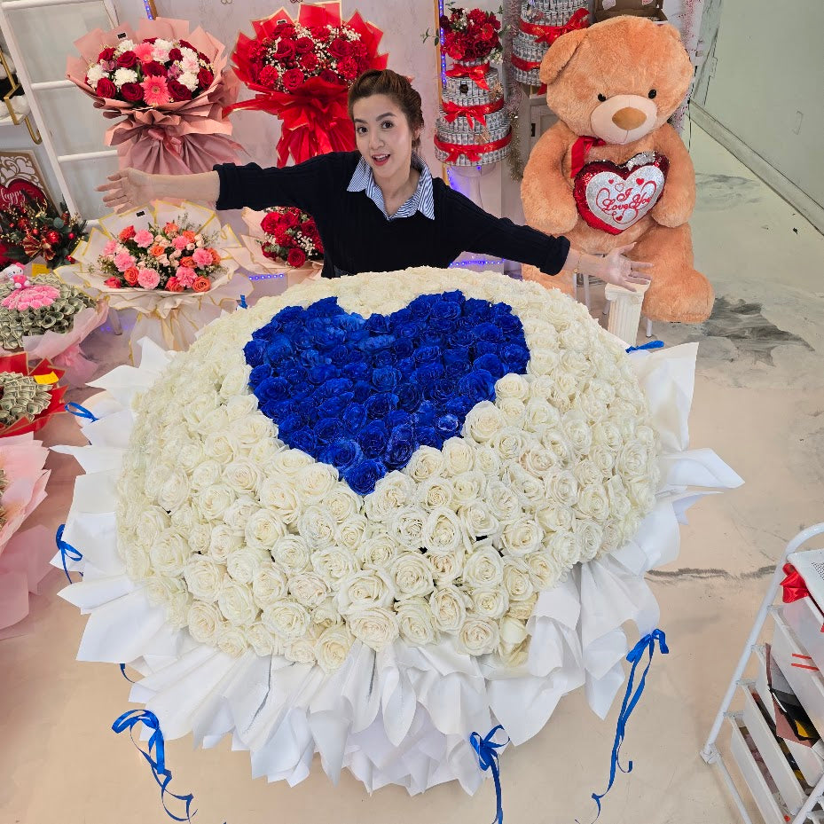 Custom blue and white heart-shaped bouquet by 98 Flowers