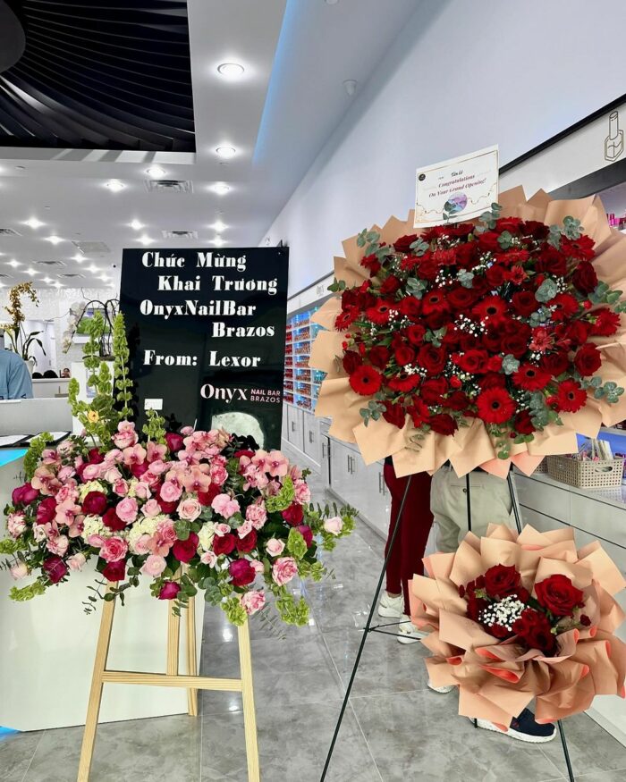 Crimson Celebration Grand Opening Standee mixed flower bouquet, red roses 