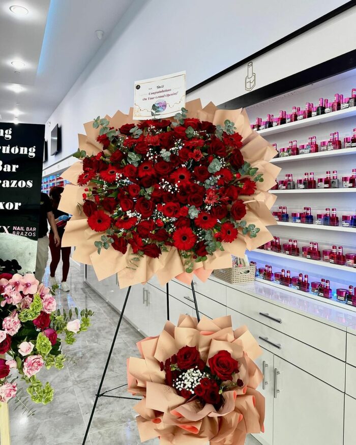 Crimson Celebration Grand Opening Standee mixed flower bouquet, red roses 