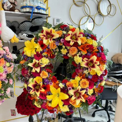 Vibrant Celebration of Life Standing Wreath – Colorful Funeral Flowers Houston  