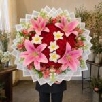 Crimson Lily Garden bouquet with 50 red roses, lilies and white tulips